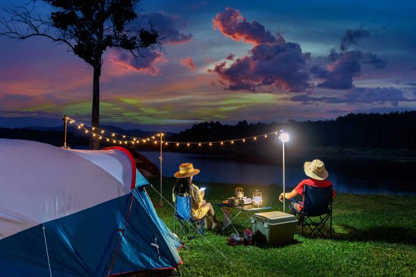 couple-tourists-enjoying-camping-by-lake